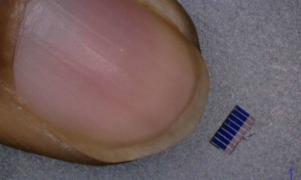 Flea-sized solar panels embedded in CLOTHES can charge a mobile phone