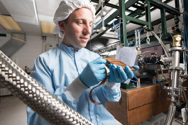 Pinning down the ampere with a supersensitive particle detector